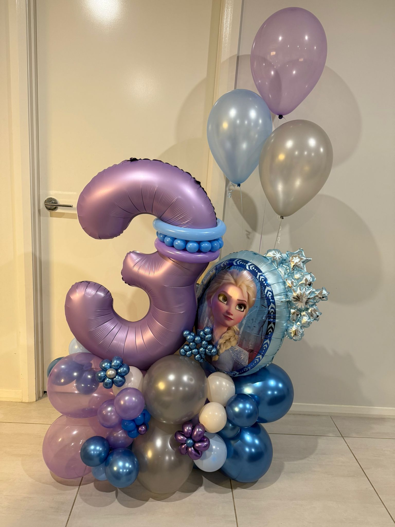 Custom balloon arrangement themed like Disney's Frozen